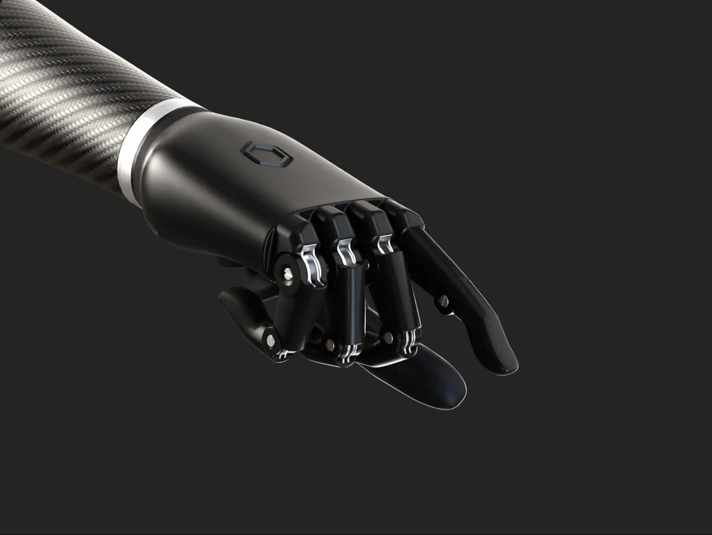 Bionic arm, outer hand view. Black hand with fingers slightly curled downward and mechanical joints visible.